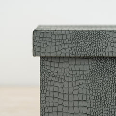 Designer storage box with crocodile finish and rich orange velvet interior for valuables