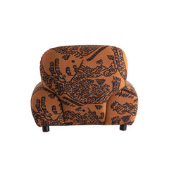 Luxury lounge chair featuring sculptural form, printed cotton linen upholstery, and durable larch wood frame for stylish homes.