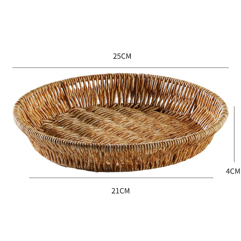 Medium round plate-style storage basket made from durable plastic rattan, perfect for accessories or household essentials.