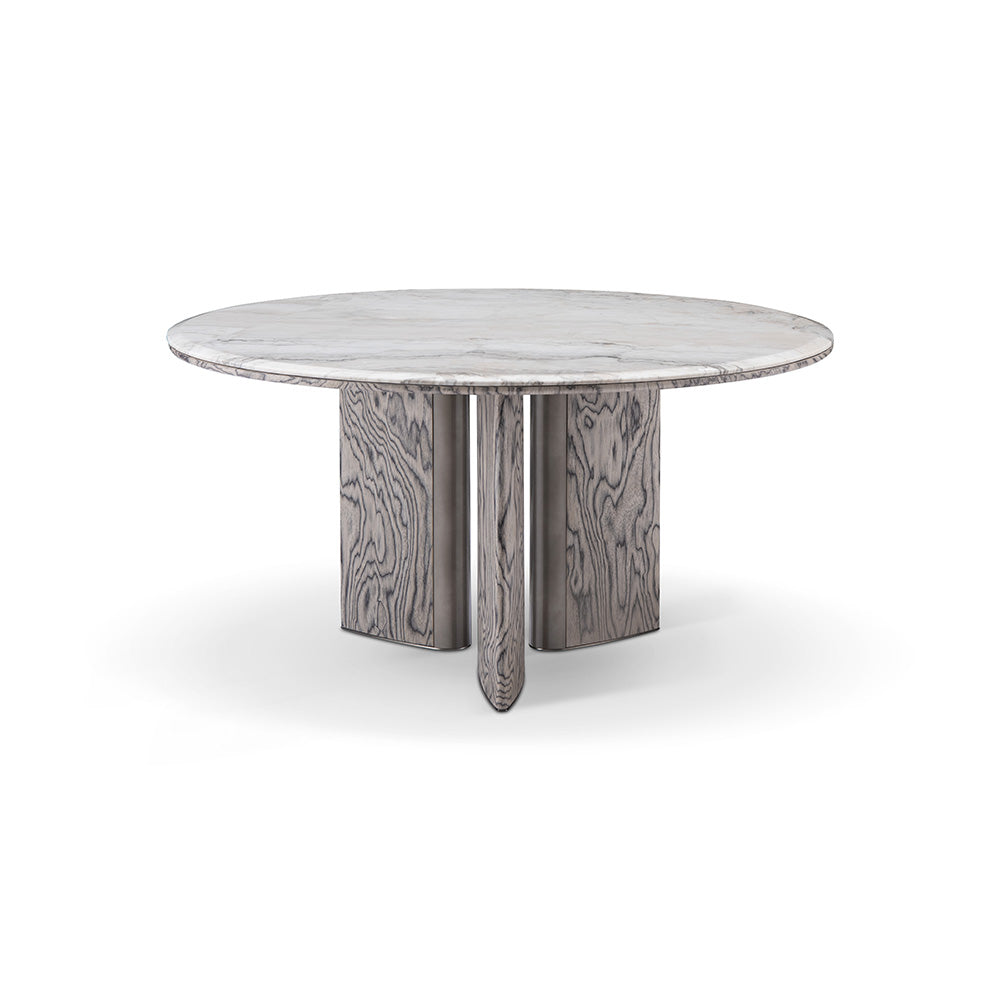 Close-up of the Stone Dining Table showcasing the striking black and white Gadoria marble top with sleek curved edges and stainless steel accents.