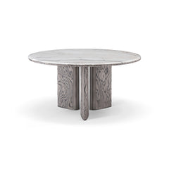 Close-up of the Stone Dining Table showcasing the striking black and white Gadoria marble top with sleek curved edges and stainless steel accents.