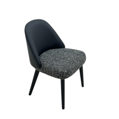 Contemporary dining chair with black ash wood legs, microfiber leather back, and fabric seat in Life Interior style