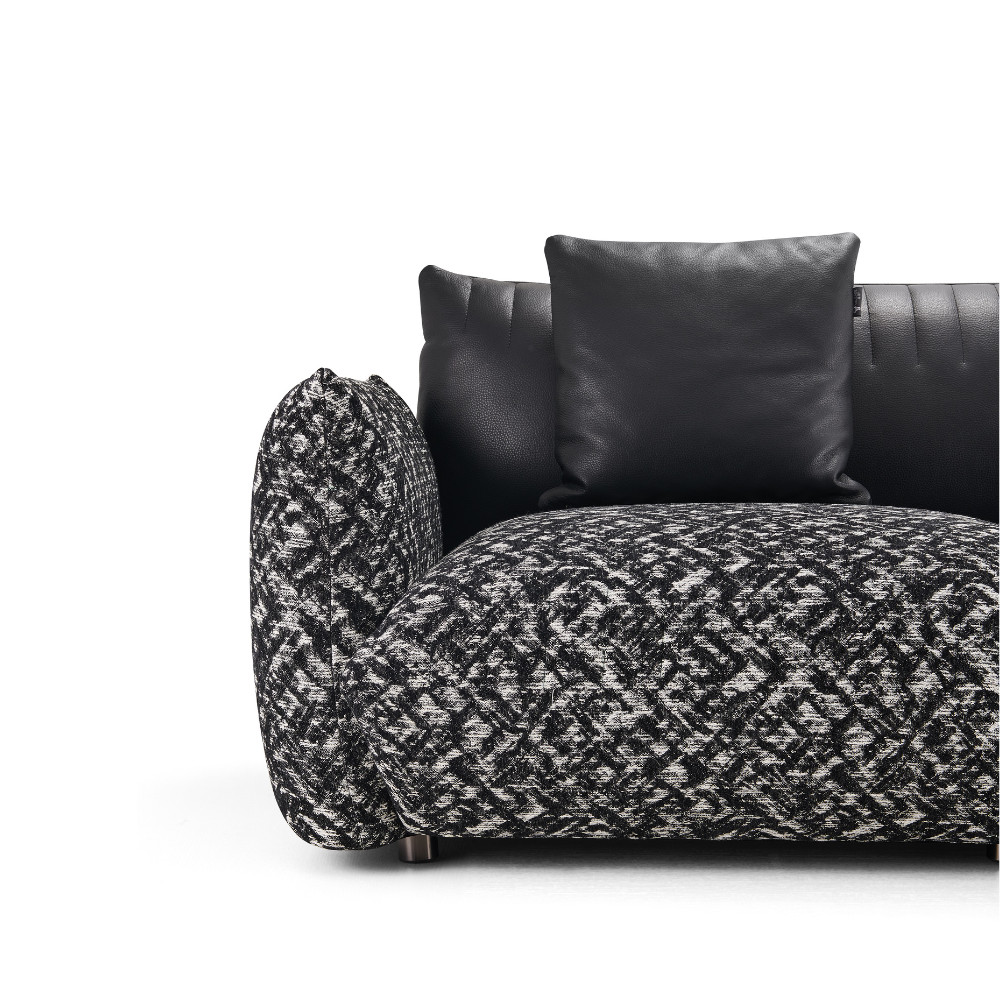 Contemporary large statement sofa with bold half leather, half fabric design