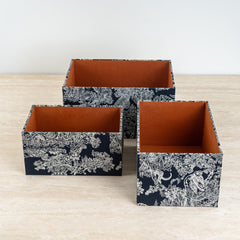 Modern storage box in ivory and black tones, ideal for organizing small essentials elegantly.