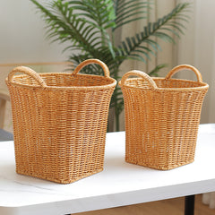 Set of decorative rattan-style storage baskets with handles, designed for versatile storage and sophisticated home décor.
