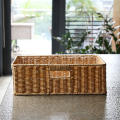 Multipurpose rectangular storage box in plastic rattan, lightweight yet sturdy, perfect for organizing household essentials.