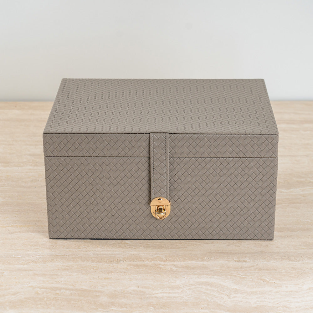 Functional leather-look storage box for organizing daily essentials.
