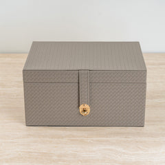 Functional leather-look storage box for organizing daily essentials.