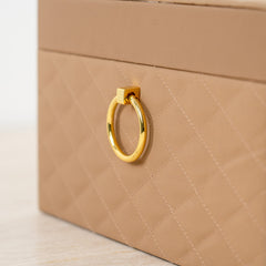 Quilted leather-look decorative storage box for sophisticated organization.