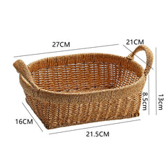 Durable oval basket with handles, designed in rattan-style plastic for organizing and decorating your home.