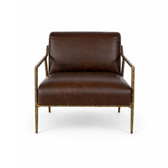 Modern leather armchair with solid forged iron frame and sculptural metal armrests.
