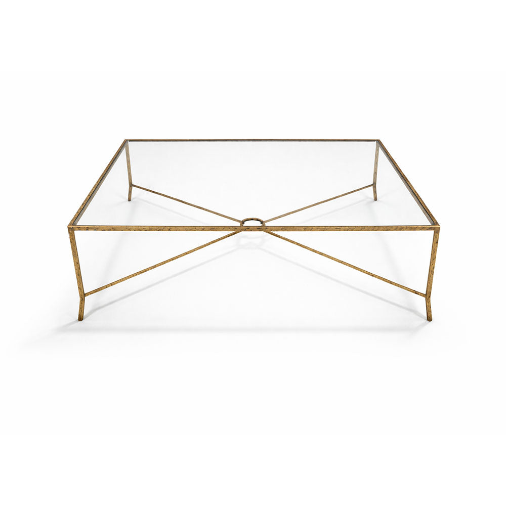 Contemporary coffee table with sculptural metal base and tempered glass top.