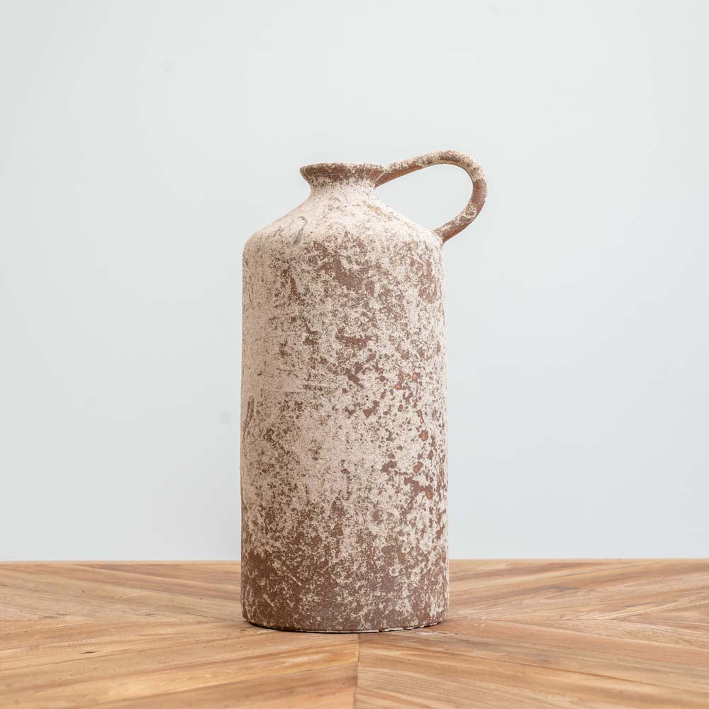 Tall narrow ceramic urn with an aged, relic-style finish, metallic accents, and a small loop handle, ideal as a decorative piece for indoor or outdoor undercover spaces.