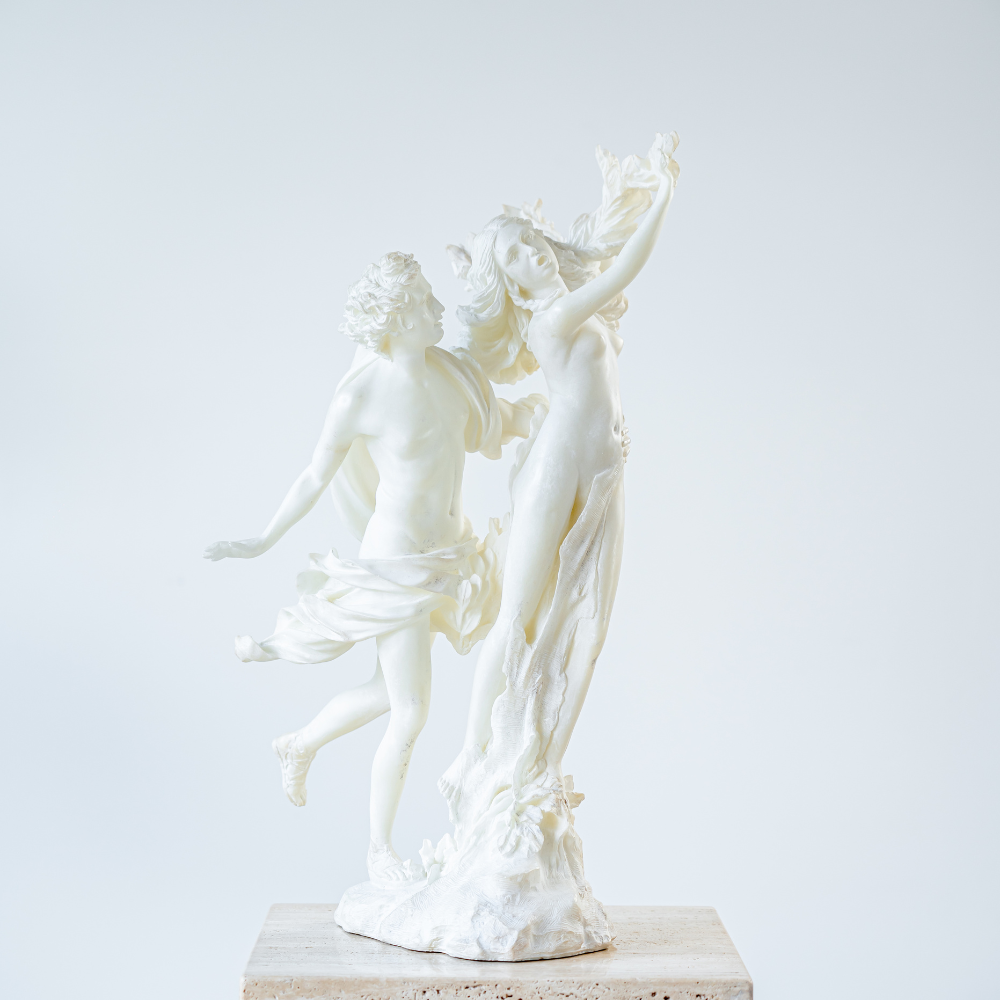 Elegant resin sculpture of Apollo and Daphne from classical mythology
