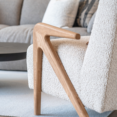 Comfortable plush grey armchair with soft chenille upholstery and solid Elm wood legs, perfect for reading corners or lounges.