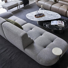 Rivn 3 Seater Sofa with curved edge design, upholstered in premium cotton linen fabric, styled in a modern living room.