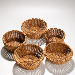 Elegant bowl-style storage basket with a scallop border, crafted from durable plastic rattan, perfect for fruits, bread, or household essentials.