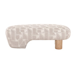Unique modern bench upholstered in patterned fabric, featuring two light timber legs, combining functionality with bold, sculptural design.