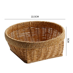 Small round storage basket with thick border and tapered square base, ideal for organizing keys, cosmetics, or other compact household items.