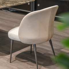 Classic yet modern Sorrento Dining Chair combining luxury materials, high-density foam cushioning, and sleek steel legs.