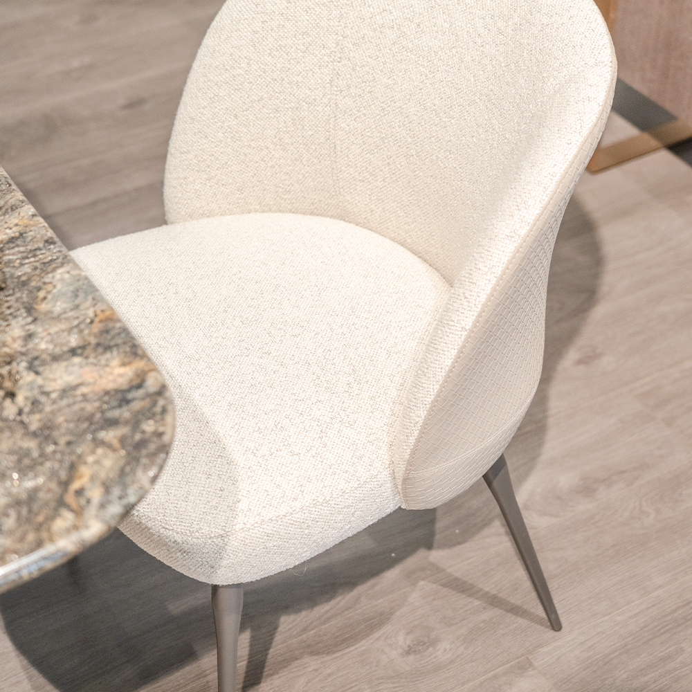 Sorrento Dining Chair upholstered in high-quality cotton linen and microfiber leather, offering a luxurious and supportive seating experience.