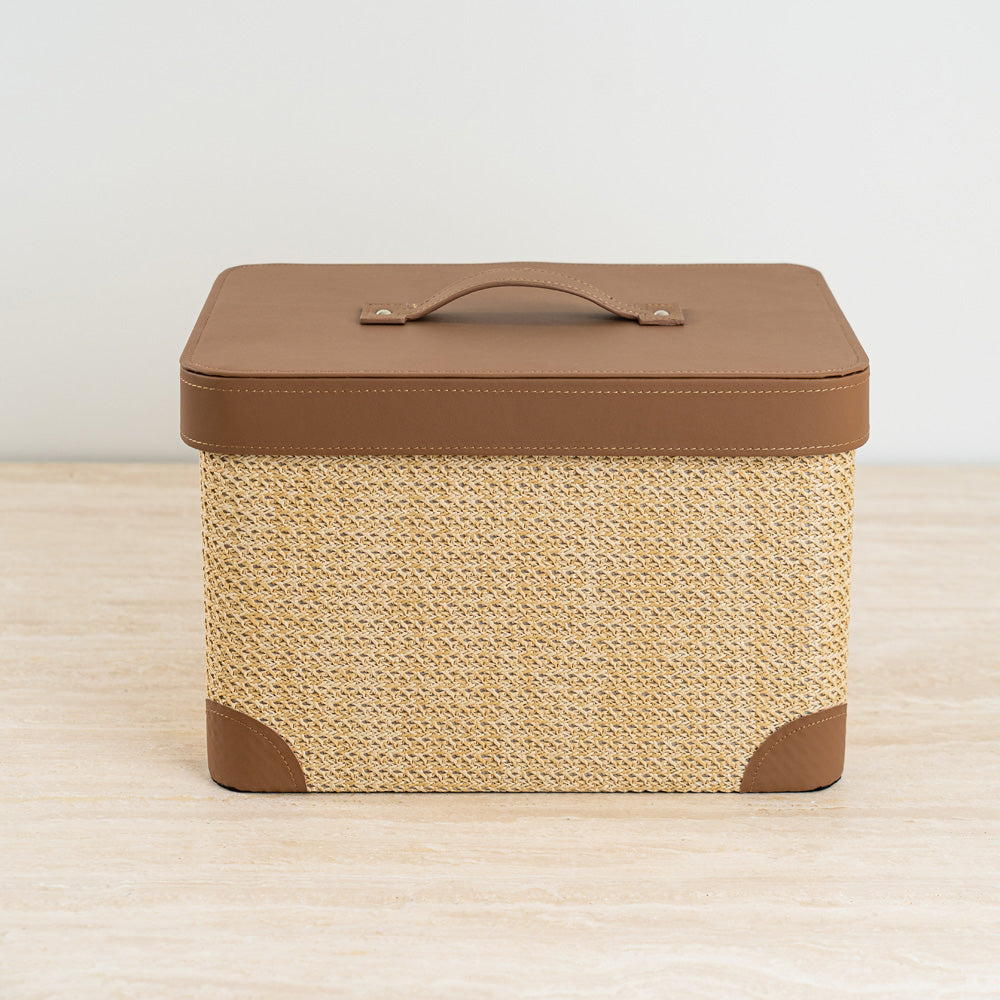 High-quality woven storage box with tan leather-look lid for everyday organization and elegance.