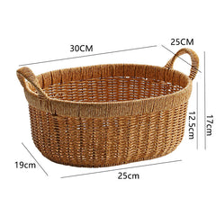 Stylish oval storage basket with handles, blending modern practicality with classic woven design.