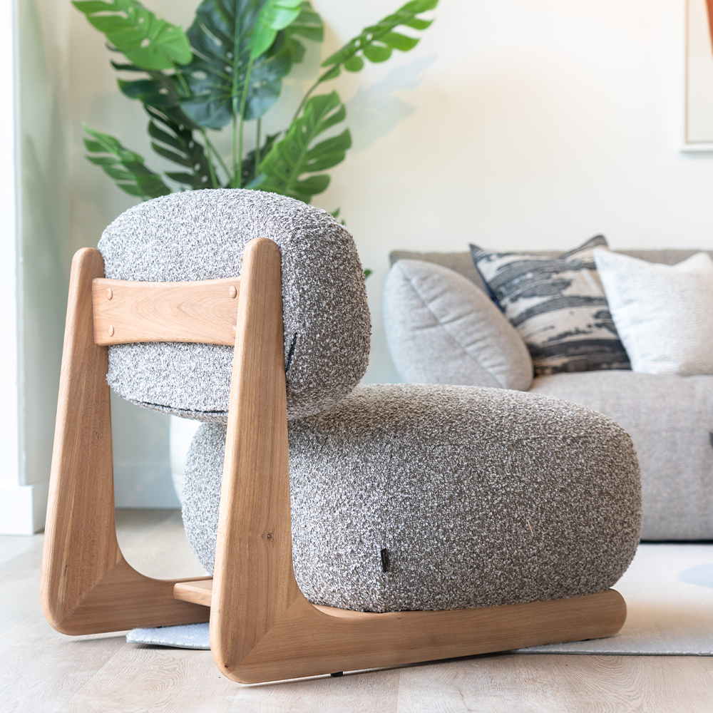 Contemporary accent chair combining plush cotton linen seating with an Elm wood frame for elegant home d??cor.
