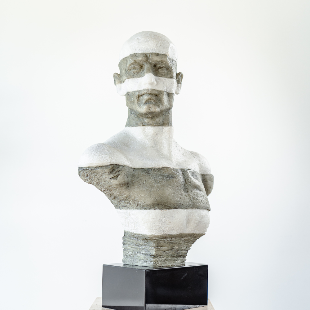 Artistic seated man sculpture capturing emotional depth and texture, ideal for home or office décor.

