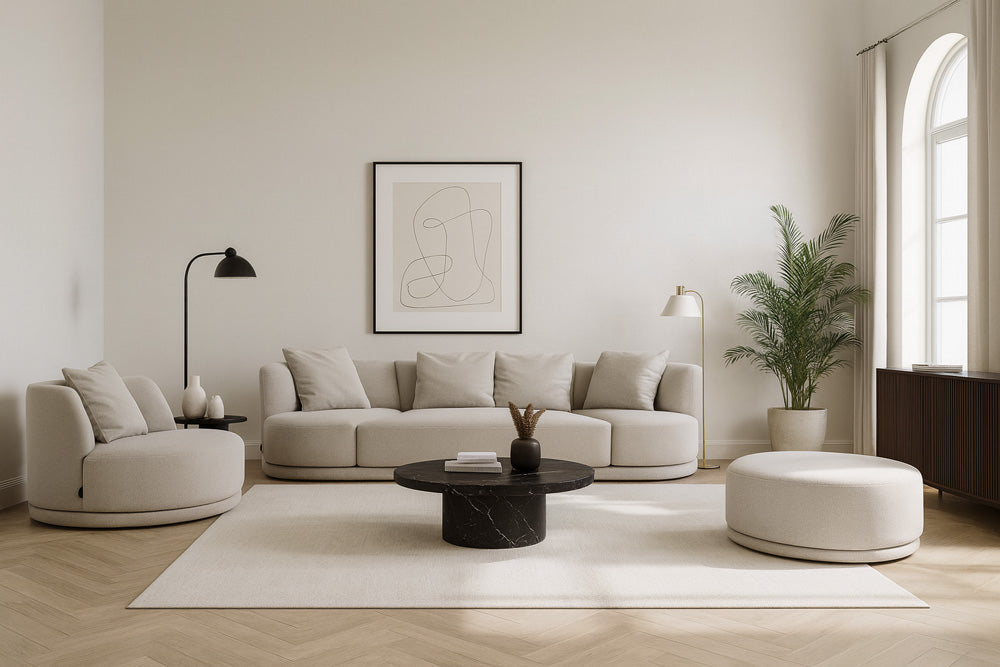 The Umea Ottoman paired with the Umea Sectional Sofa, creating a cohesive, sculptural living room ensemble in soft neutral tones and tactile woven upholstery.