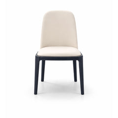 Classic dining chair upholstered in cream microfiber leather with dark contrast legs, offering comfortable and stylish seating for modern dining spaces.