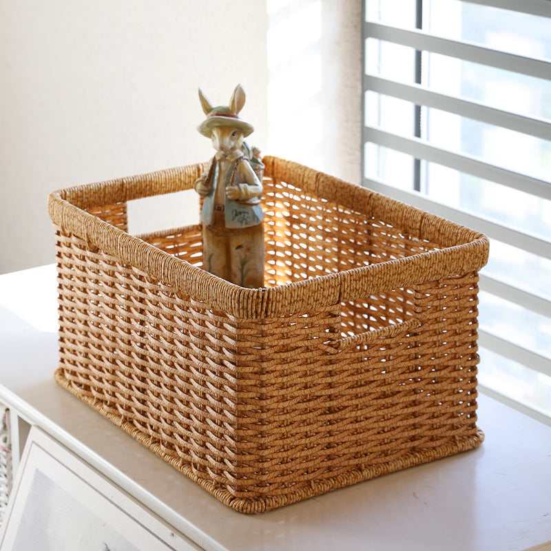 Versatile rectangular plastic rattan storage basket with handles, lightweight yet durable for everyday storage.