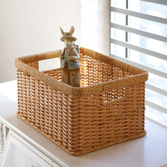 Versatile rectangular plastic rattan storage basket with handles, lightweight yet durable for everyday storage.