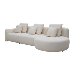 Close-up of the Vihta sofa’s sculptural moon-shaped chaise, highlighting its smooth curves, textured upholstery, and elegant stitching.