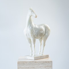 Detailed white horse figurine in art resin showcasing noble stance and timeless style.