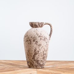Rustic aged urn featuring a metallic glaze and organic finish, perfect as a decorative vase for fresh or dried flowers.