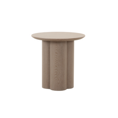 Wyler side table with round top and sculptural petal-inspired legs, a modern accent table for stylish living rooms.