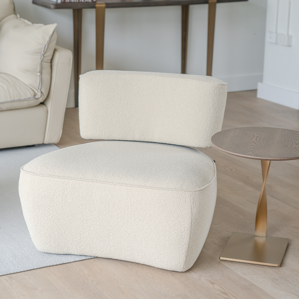 Elegant living room chair with brushed bronze highlights