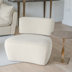 Elegant living room chair with brushed bronze highlights