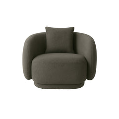 The Zoi Swivel Chair in soft grey textured bouclé, showcasing its rounded silhouette, plush cushioning, and contemporary swivel design in a neutral interior space.