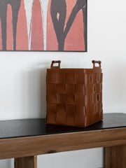 Stylish hand-woven brown bridle leather storage basket, perfect for modern and luxury interiors. Ideal for organizing blankets, magazines, and home essentials with elegance and durability.