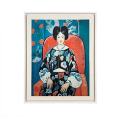 A framed art print featuring a stylized portrait of a woman seated in a red chair against a blue floral background, shown in a white frame on a light gray background.