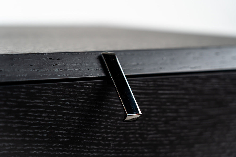 Black bedside table with rotating drawers, sleek modern design, versatile storage furniture