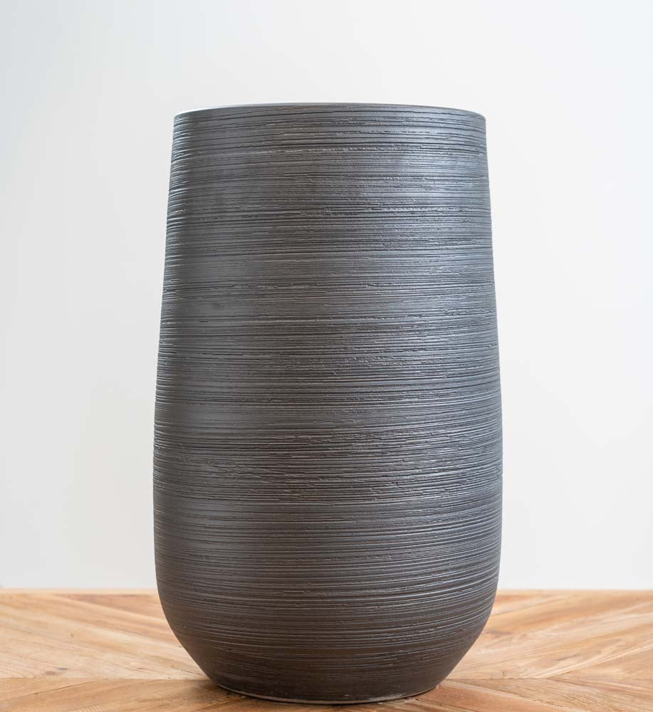 Largest black ceramic patina pot with circular textured pattern, frost-proof and ideal for outdoor or indoor plants with drainage hole.