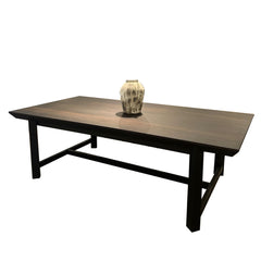 Boras 8-seater dining table with walnut finish and black iron trestle legs in a modern dining room setting