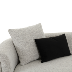 Contemporary light grey 2-seater sofa with plush seating and modern tapered armrests, perfect for living rooms.