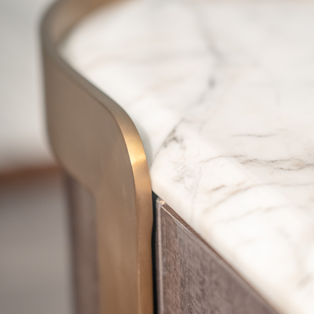 Contemporary sideboard combining dark oak and marble for a sleek, modern home aesthetic.