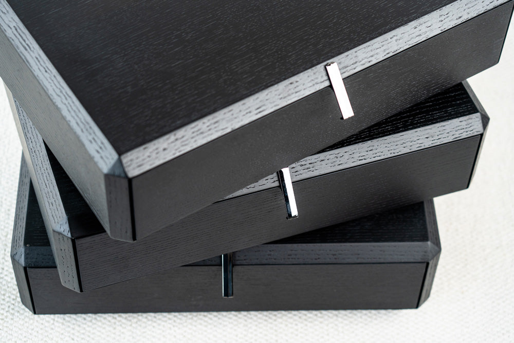 Designer rotating bedside table in black with unique swivel drawers, contemporary nightstand style