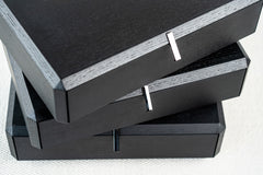 Designer rotating bedside table in black with unique swivel drawers, contemporary nightstand style