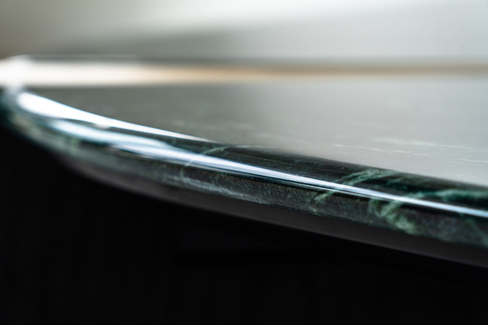 Designer coffee table with Verde Green marble surface, brass detailing, and oak support, statement luxury furniture